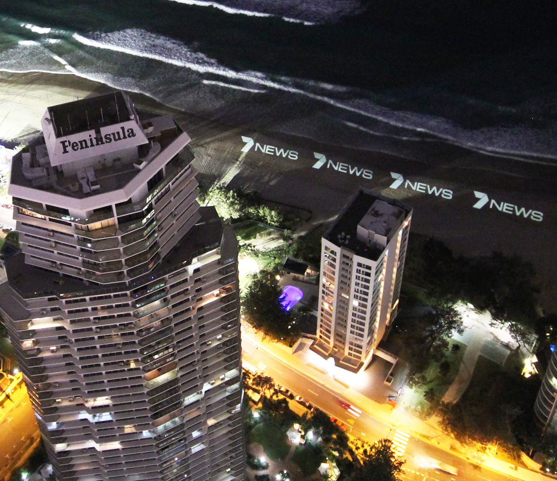 Elevated night view of Gold Coast buildings illuminated for the Seven News launch.