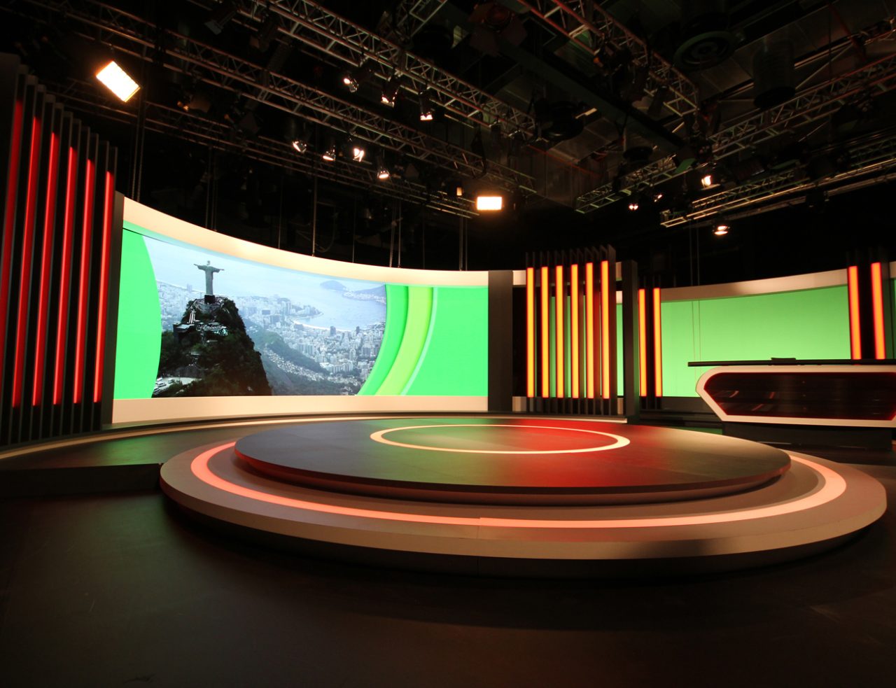 Angled view of the circular studio platform and curved LED backdrop.