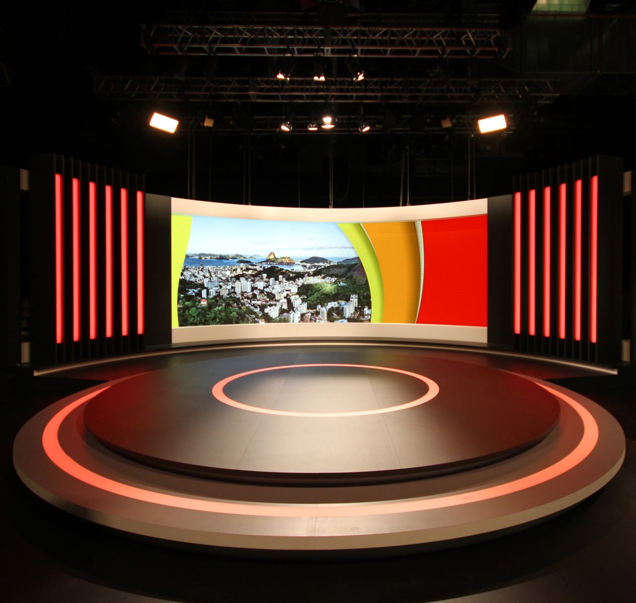 Front view of the Rio Olympics studio with a circular platform and curved video wall.