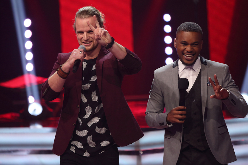 Two male singers performing together on The Voice South Africa.