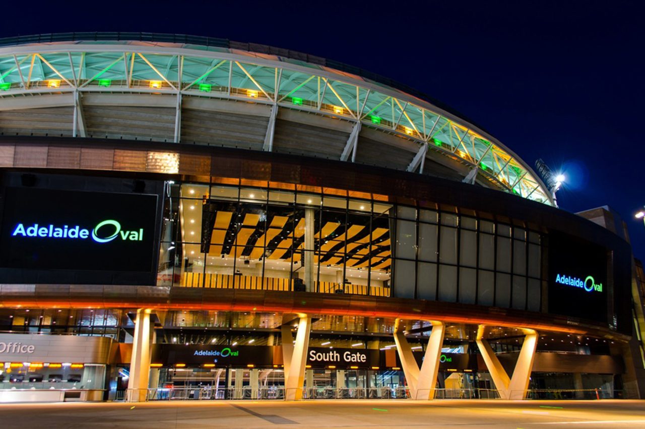 Colourful architectural lighting above the Adelaide Oval entrance.