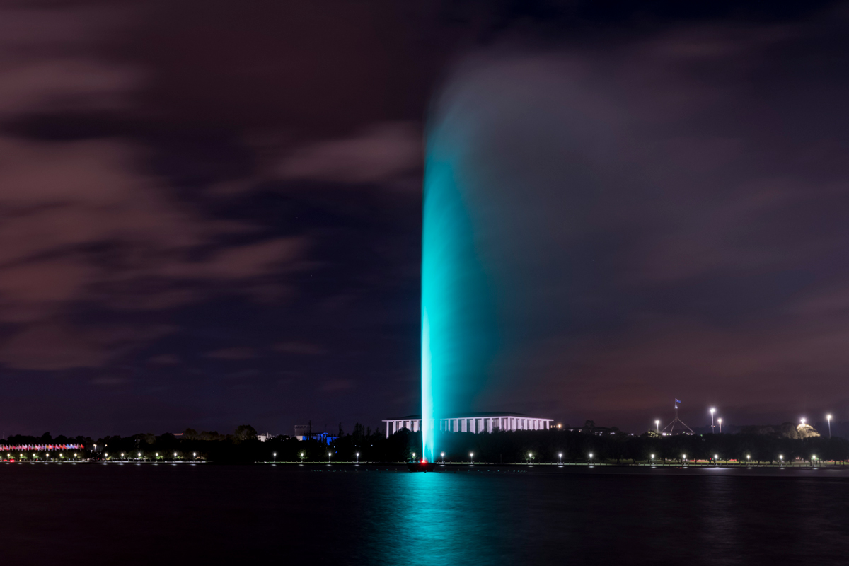 Cyan lighting through the Captain Cook Memorial Jet at night.