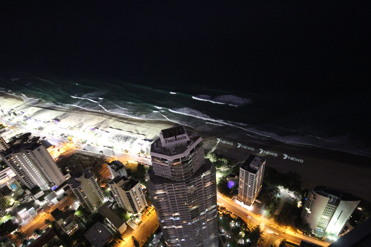 Illuminated beachfront viewed from above during the Channel 7 News Gold Coast launch.