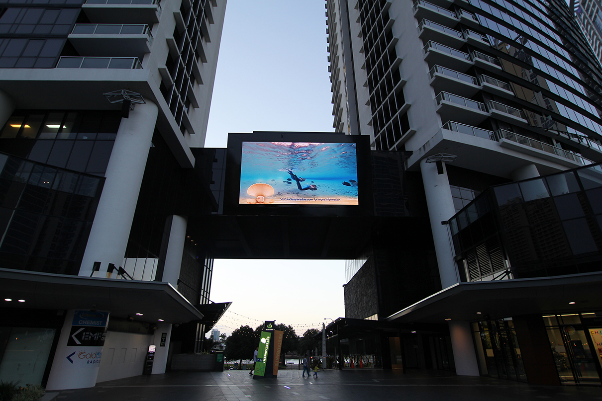 Large outdoor screen above the courtyard passage at Circle on Cavill.