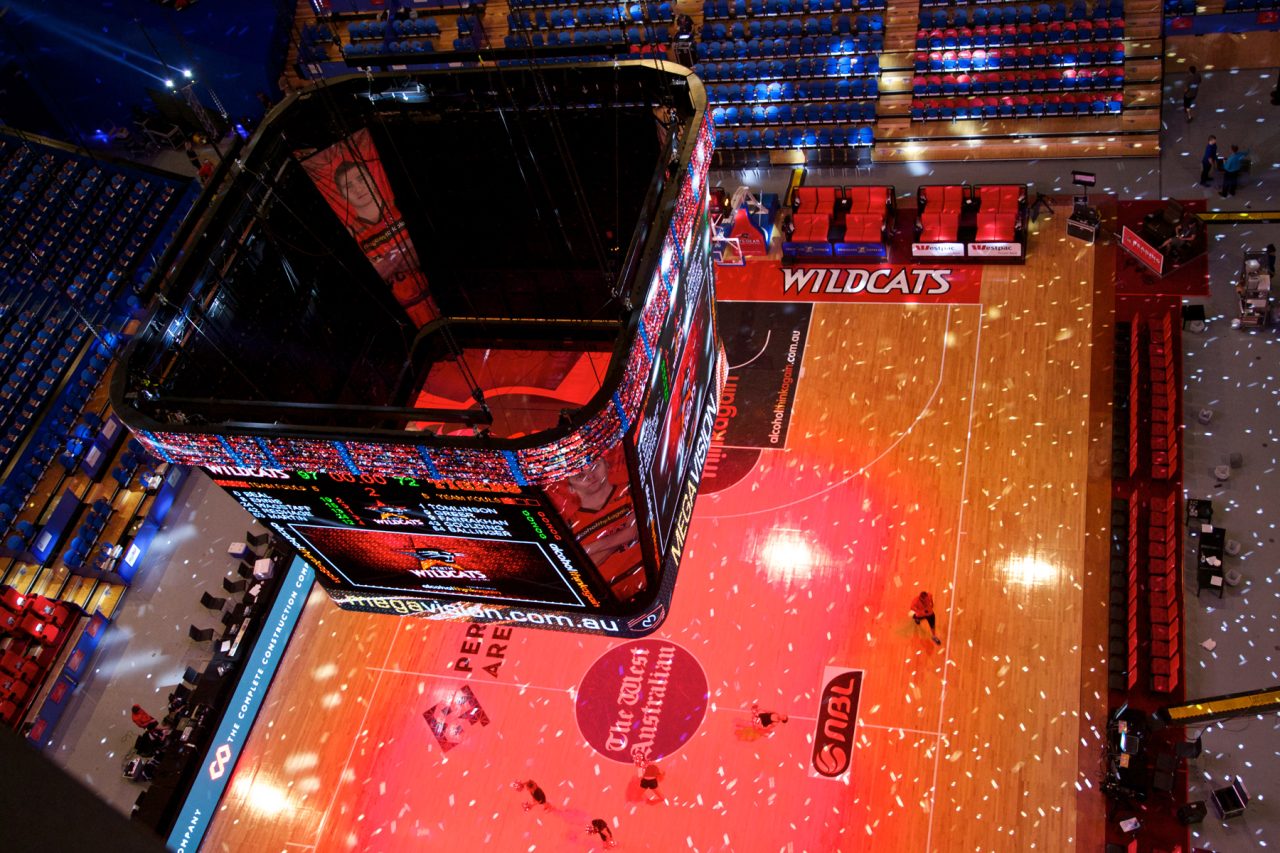 Overhead view of the Perth Wildcats court beneath the suspended video scoreboard.