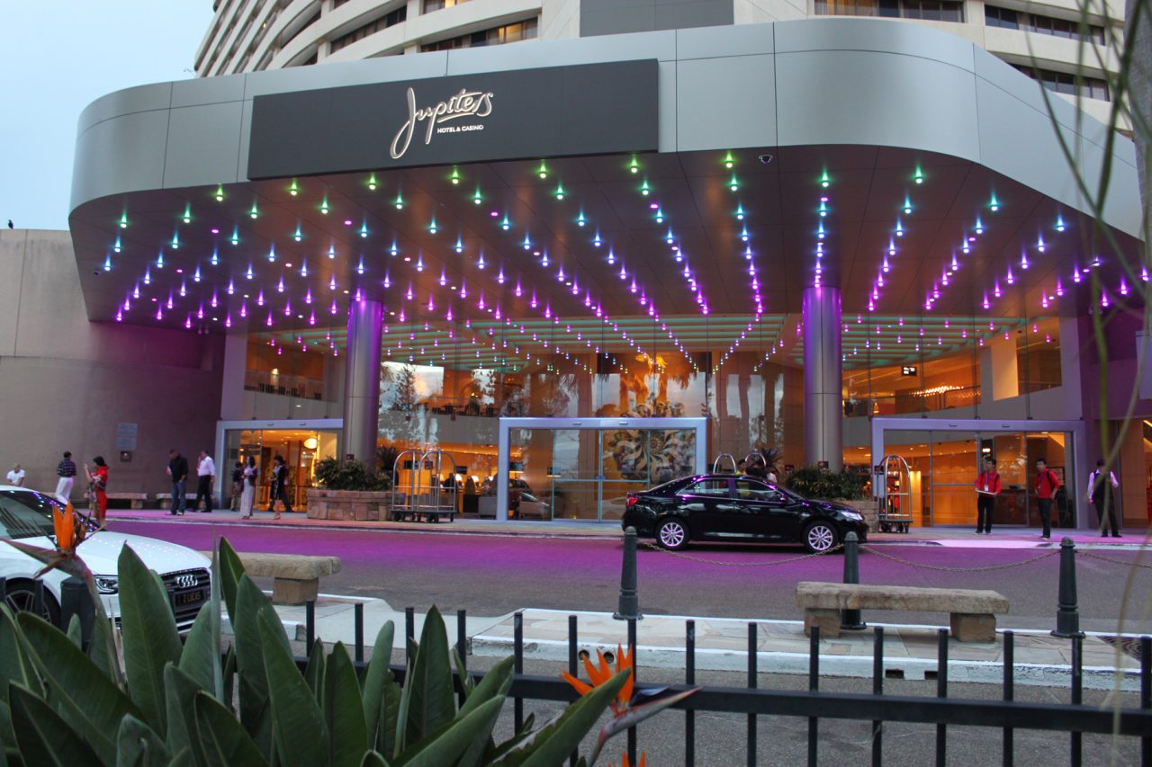 Purple canopy lights at The Star Gold Coast entrance in daylight, with the former Jupiters sign.