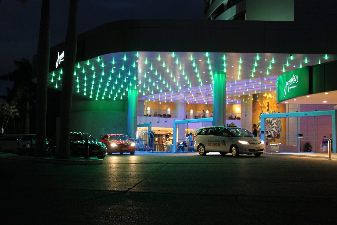 Green lights across the entrance canopy above cars at The Star Gold Coast.