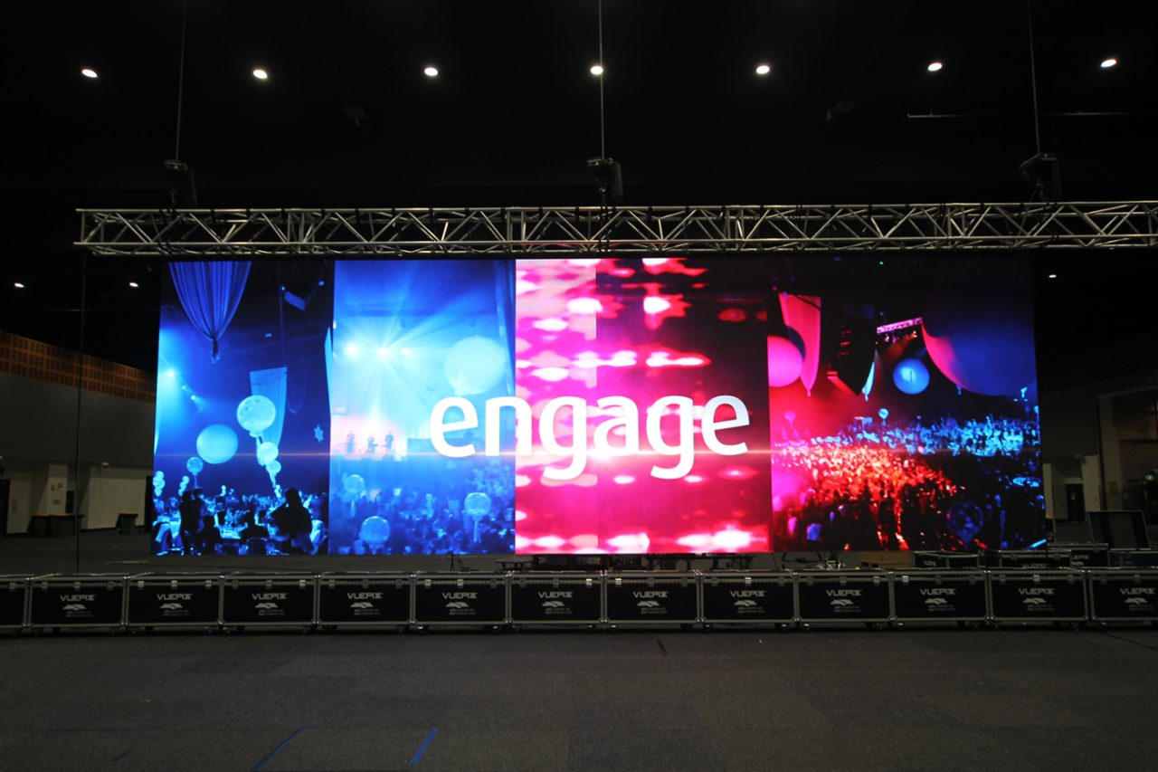 Wide VuePix LED screen displaying colourful Engage graphics at the convention centre.