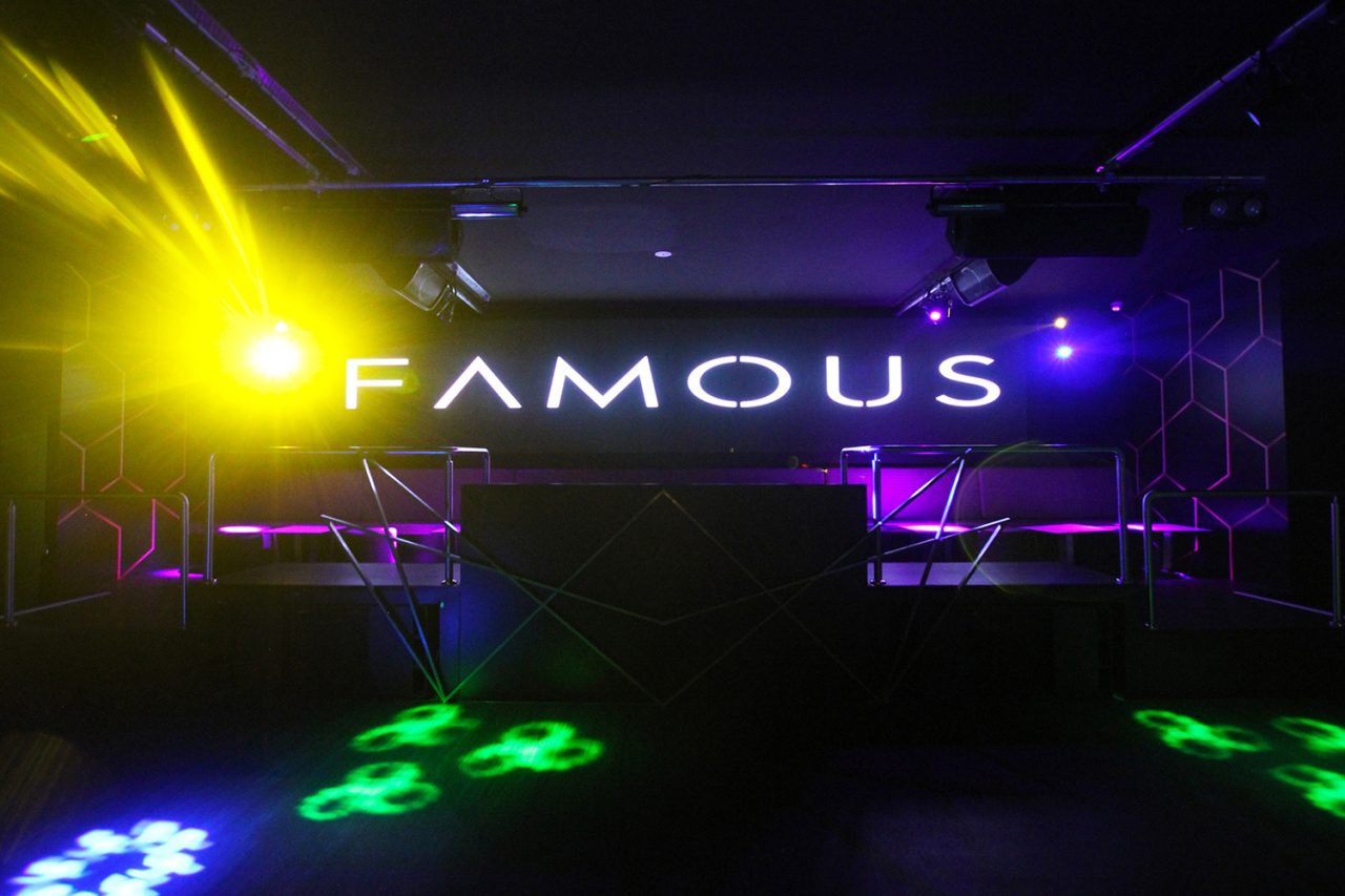 Yellow beams and green floor patterns beneath the Famous screen.