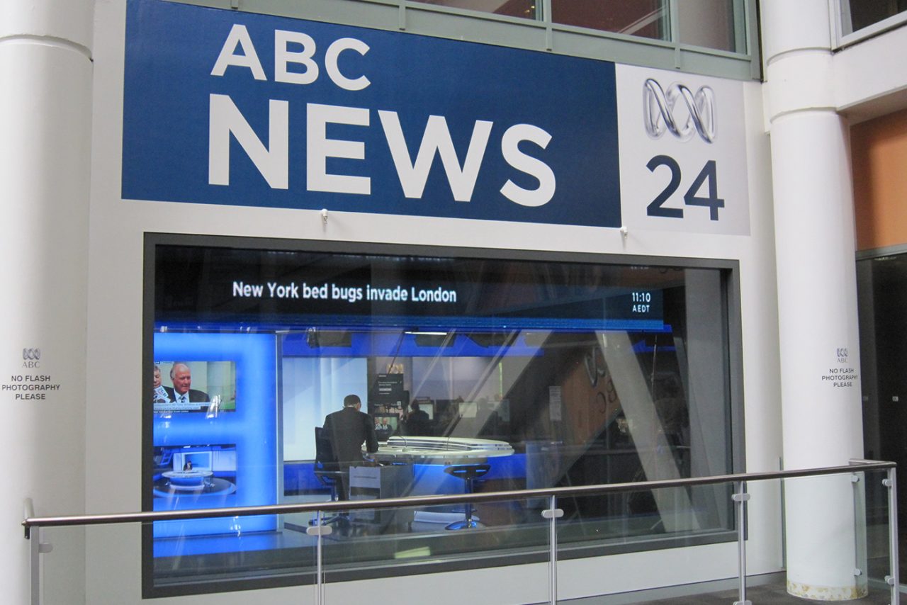 News ticker above the glass-fronted ABC News 24 studio.