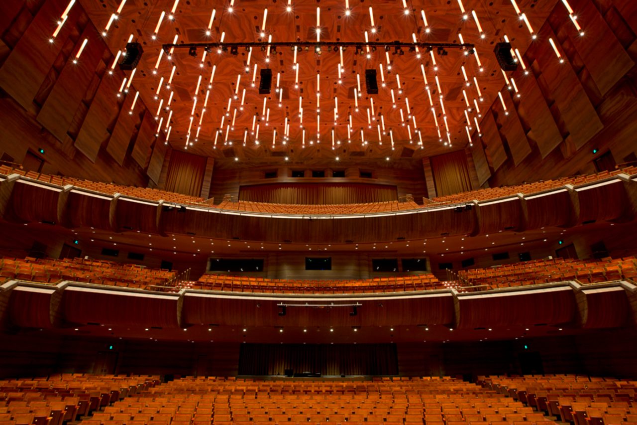 Hamer Hall's suspended ceiling lights above the curved auditorium balconies at Arts Centre Melbourne.