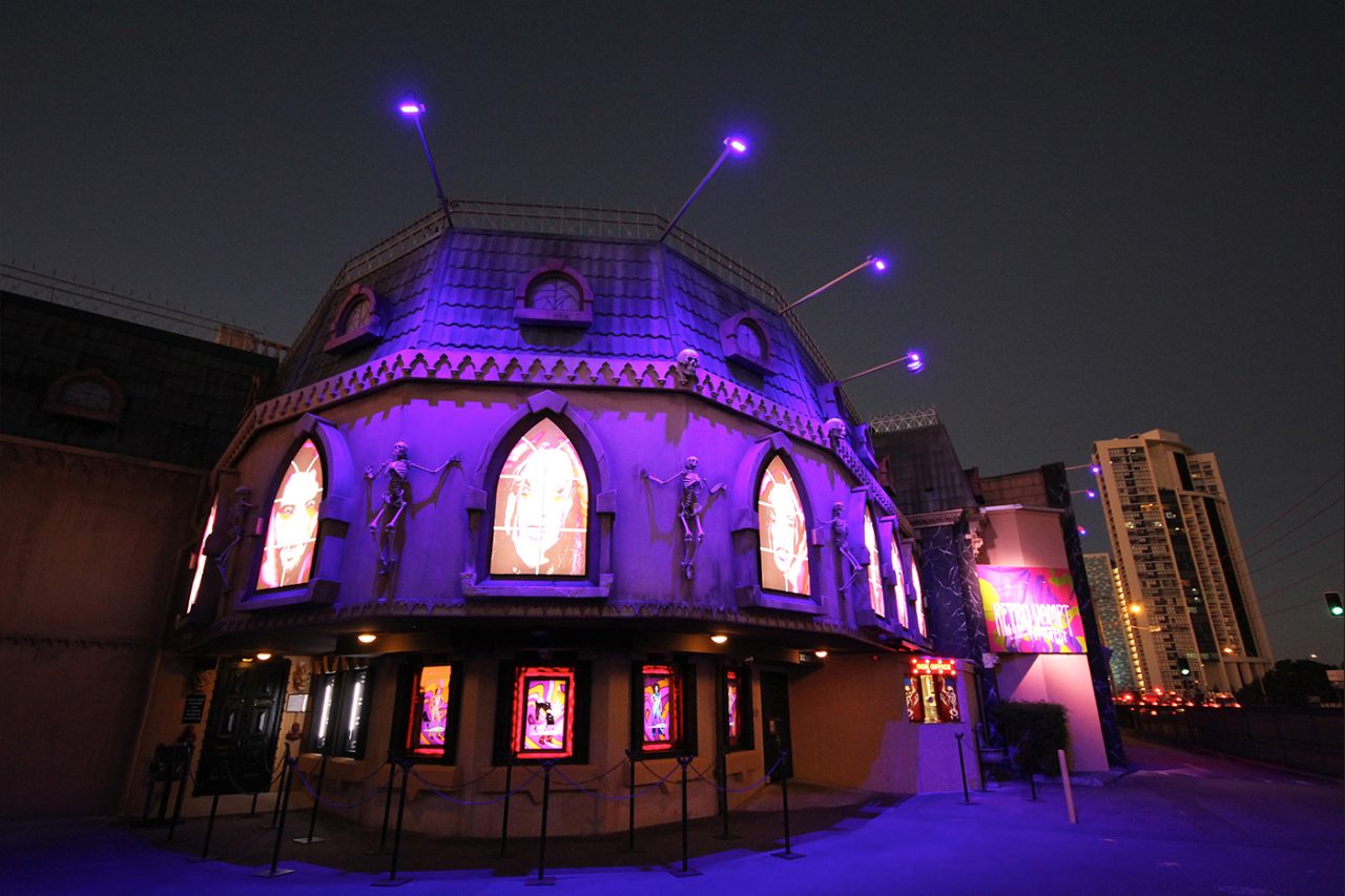 Purple lighting around the curved tower and windows at Dracula's Cabaret Restaurant.