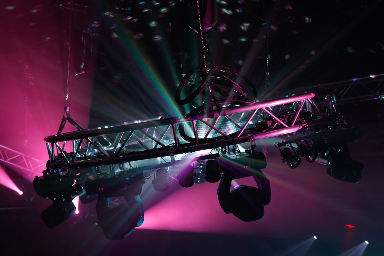 Close view of suspended lighting fixtures and coloured beams at the GH Hotel.