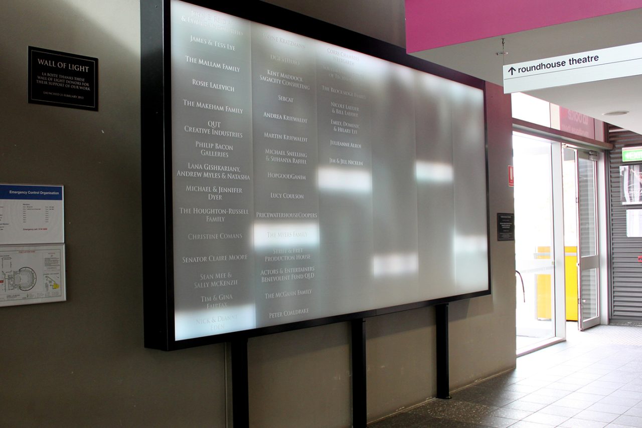 Information text on La Boite Theatre's large foyer display.
