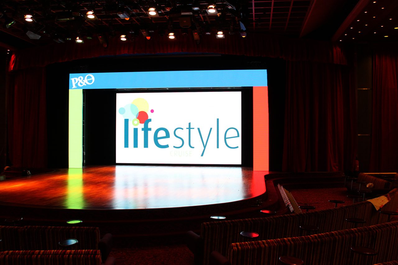 Lifestyle branding on the Pacific Dawn theatre's digital backdrop.