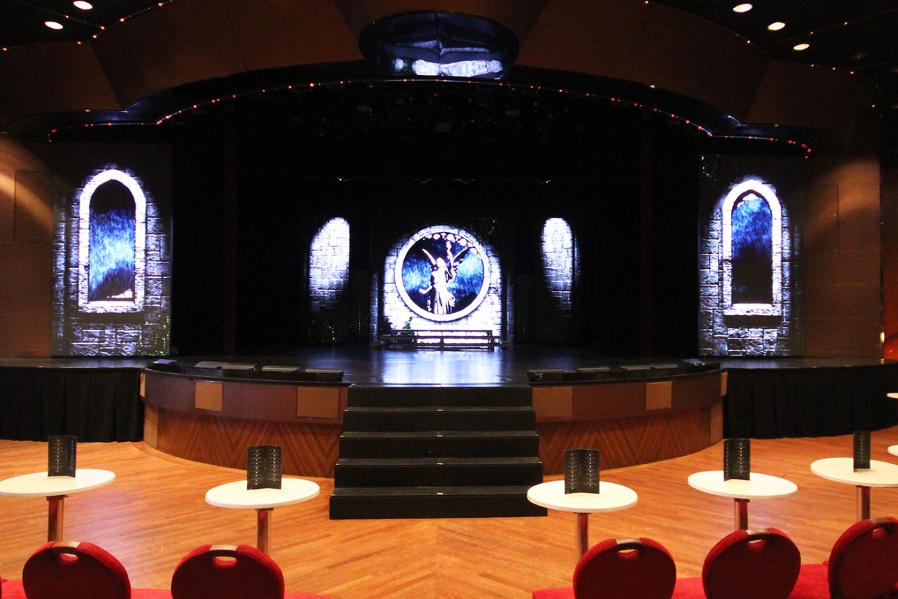 Digital arched windows and a circular centre graphic on the Pacific Eden stage.
