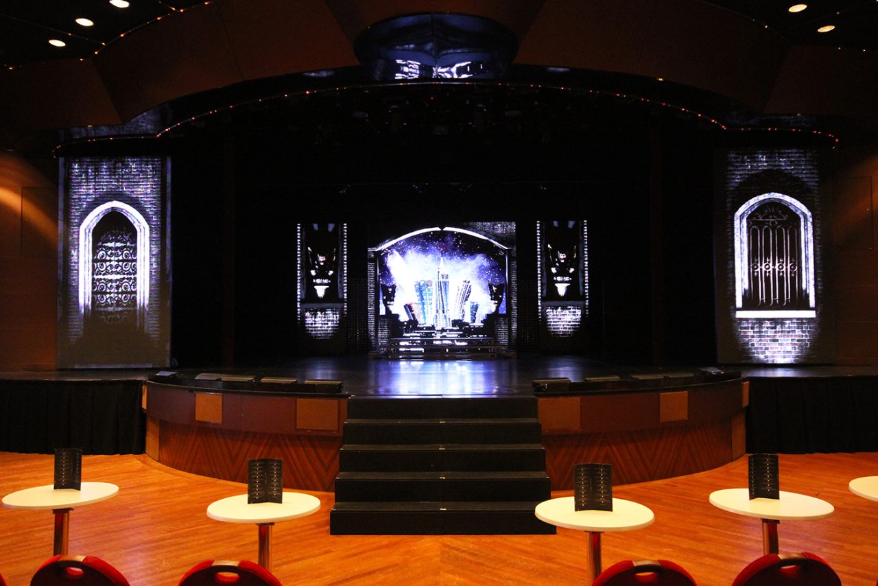 Digital window scenery across the Pacific Eden stage above the theatre seating.