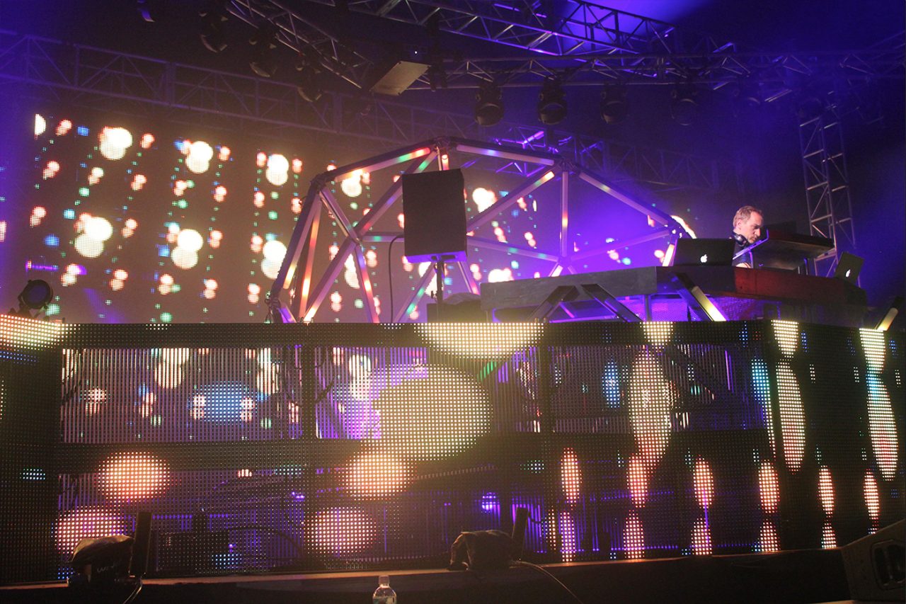 Close view of the DJ platform surrounded by patterned video panels at a Paul van Dyk show.