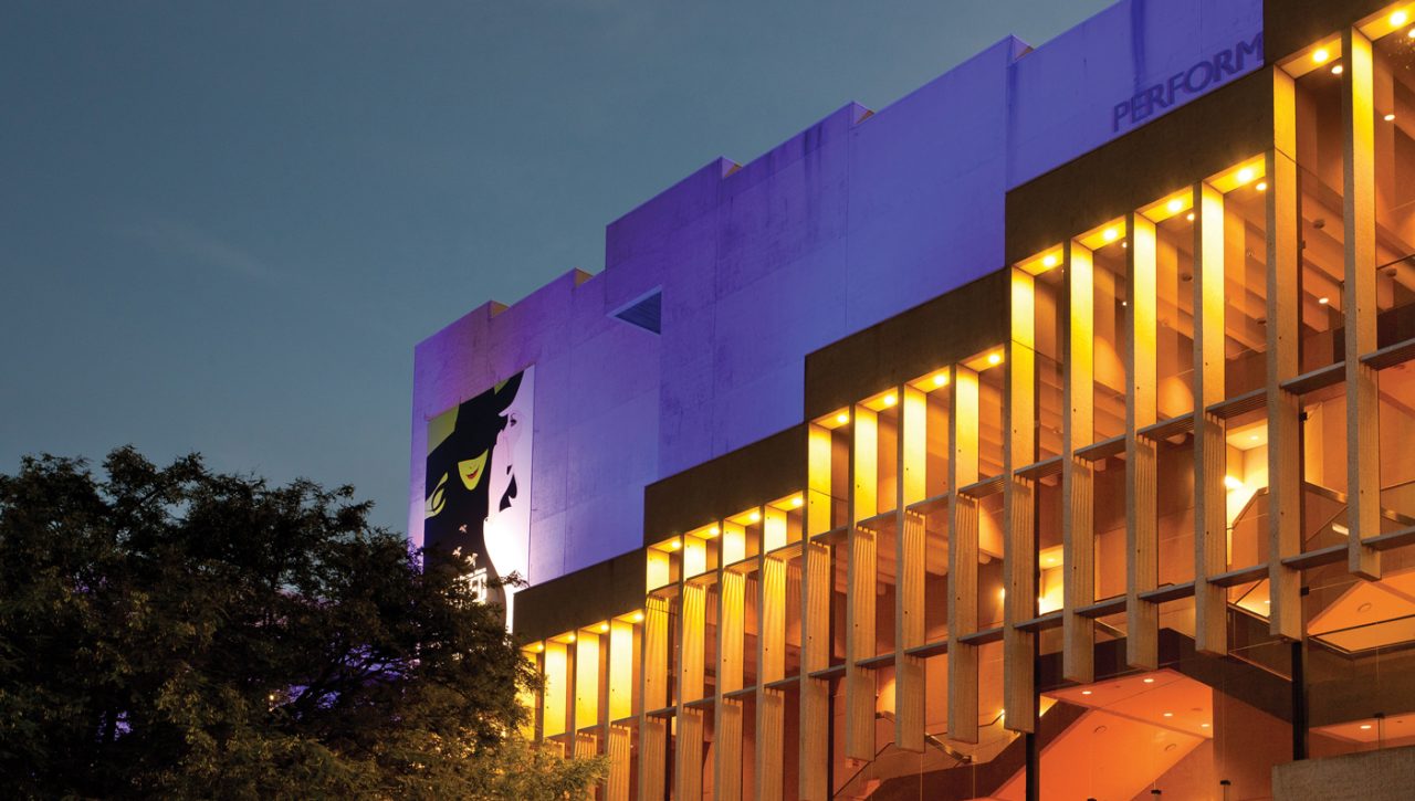 Purple upper walls and amber columns on the QPAC facade.
