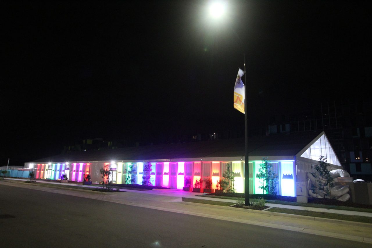 Rainbow lighting along an outdoor walkway at the 2018 Commonwealth Games Village.