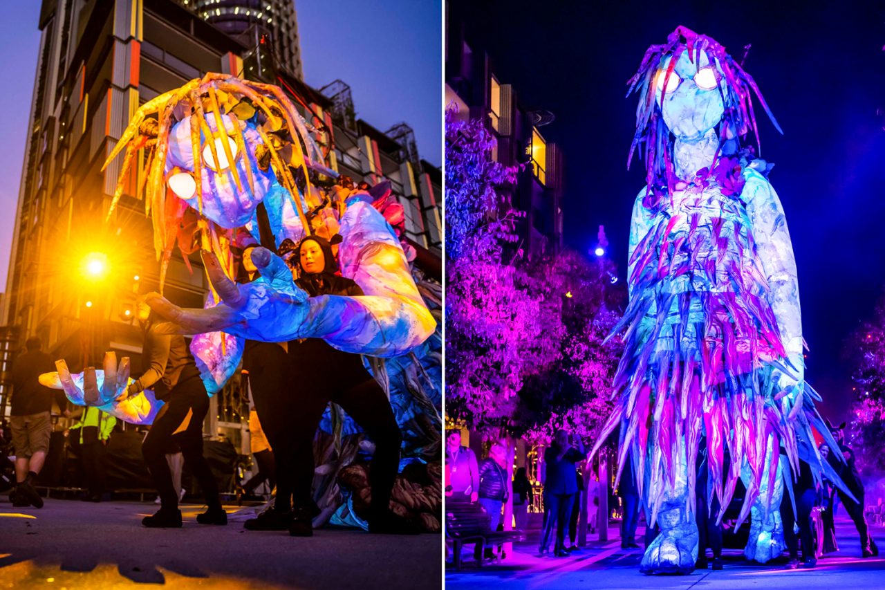 Gold and purple lighting on the large puppet in The Liminal Hour at Vivid Sydney.