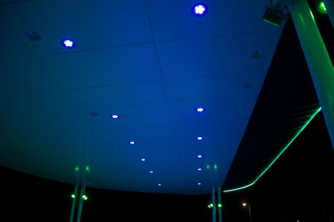 Blue ceiling lighting and green edge lighting beneath the Yeppoon beachfront amphitheatre canopy.
