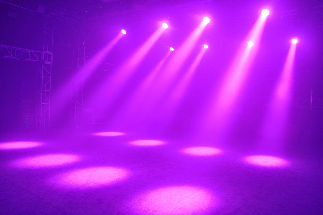 Acme CM-300ZR II fixtures creating purple beams and pools of light.
