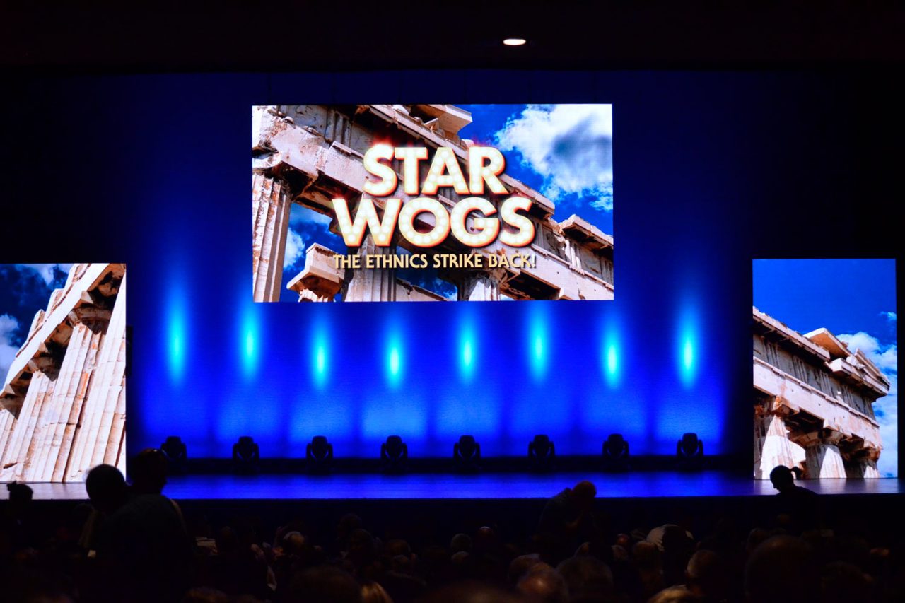 Star Wogs stage screens above blue uplighting.