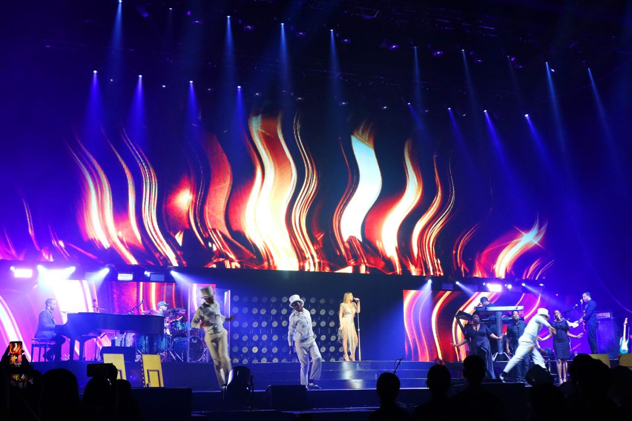 Flame-like graphics across the stage screens at Mariah Carey's Bangkok concert.