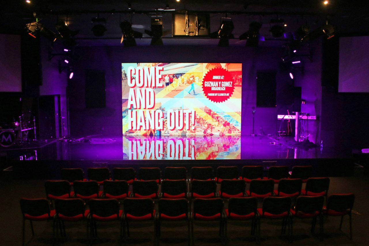 Youth event graphics on the screen behind the Metro Church stage.