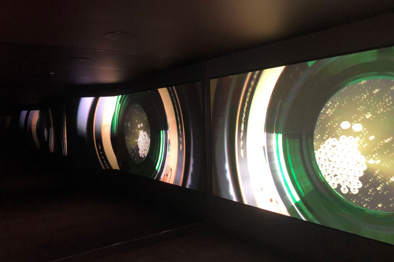 Sparkling wine imagery across the panoramic video wall in the Domaine Chandon exhibit.