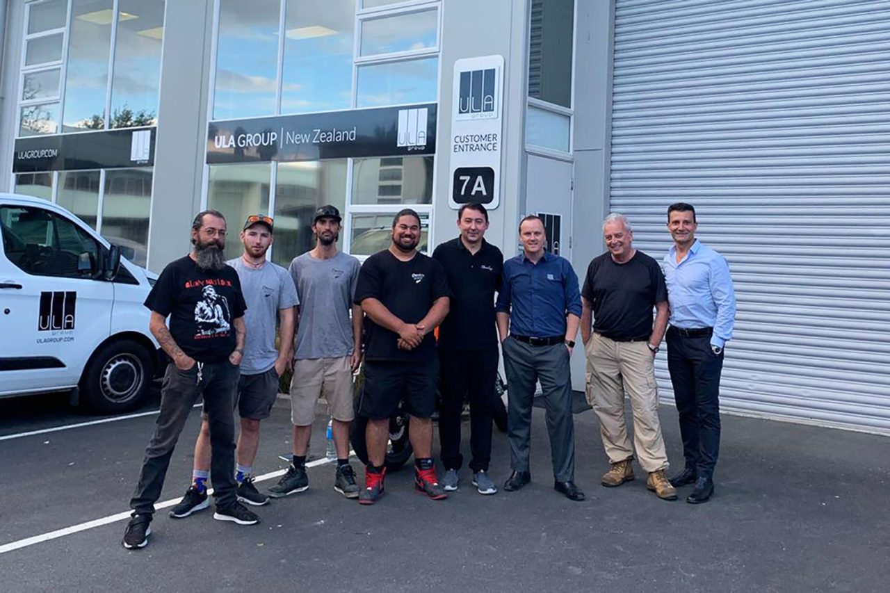 ChamSys training participants posing outside a warehouse in New Zealand.
