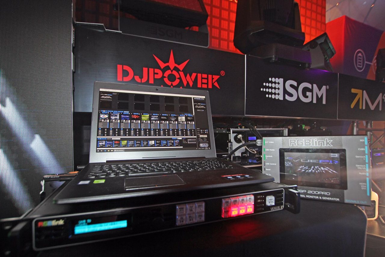 Lighting control equipment displayed beneath DJPOWER and SGM banners.