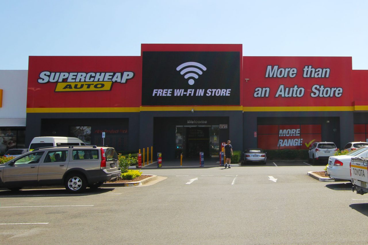 Free Wi-Fi message on the digital screen above Supercheap Auto Penrith's entrance.