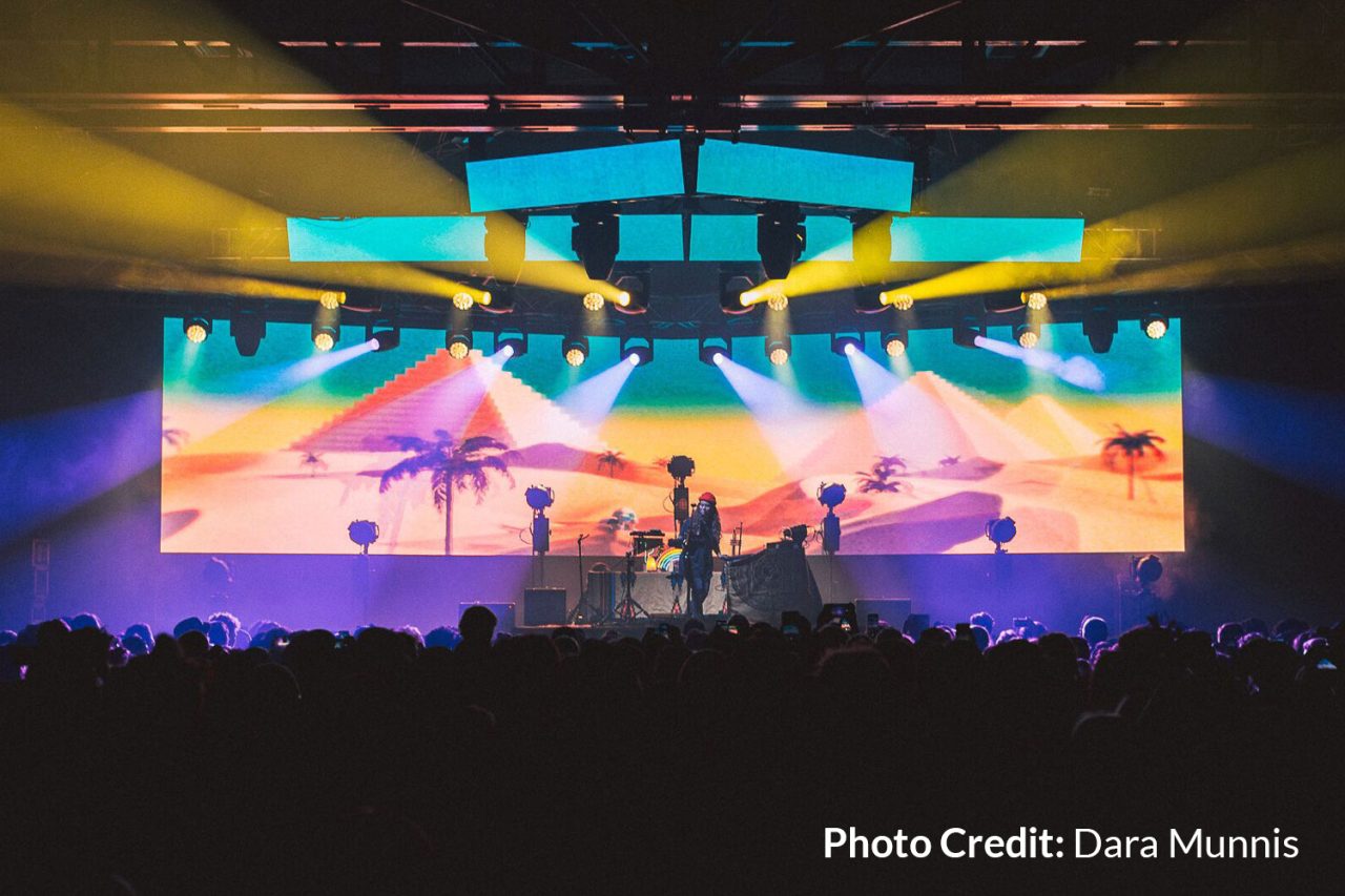 Tropical imagery across the wide video backdrop on the Flow State tour.
