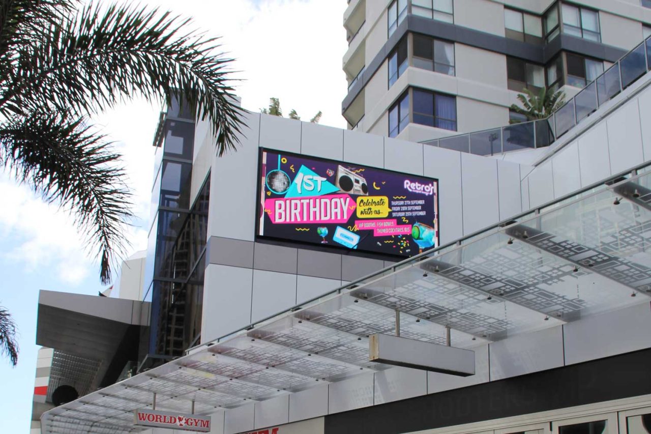 Colourful birthday promotion on The Mark's outdoor facade screen.