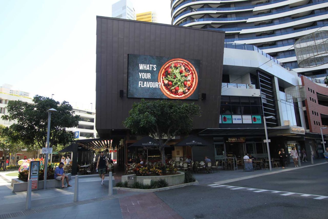 Food advertising on the Oracle Boulevard facade screen in Broadbeach.