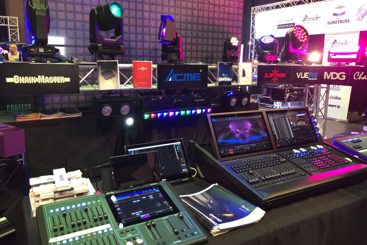 Lighting consoles and product displays on the ULA ETNZ conference stand.