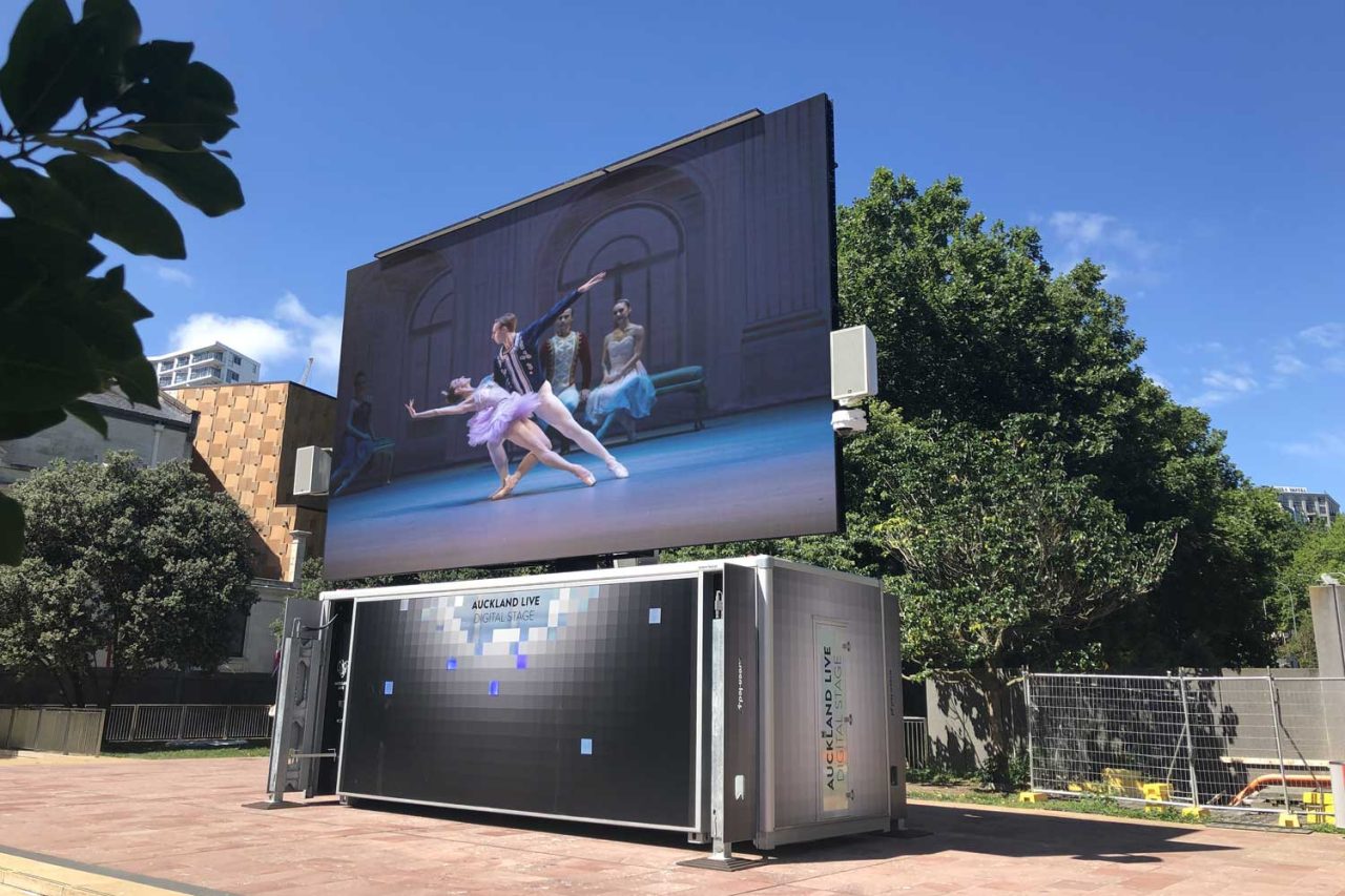 Dance footage on the large outdoor Auckland Live Digital Stage screen.