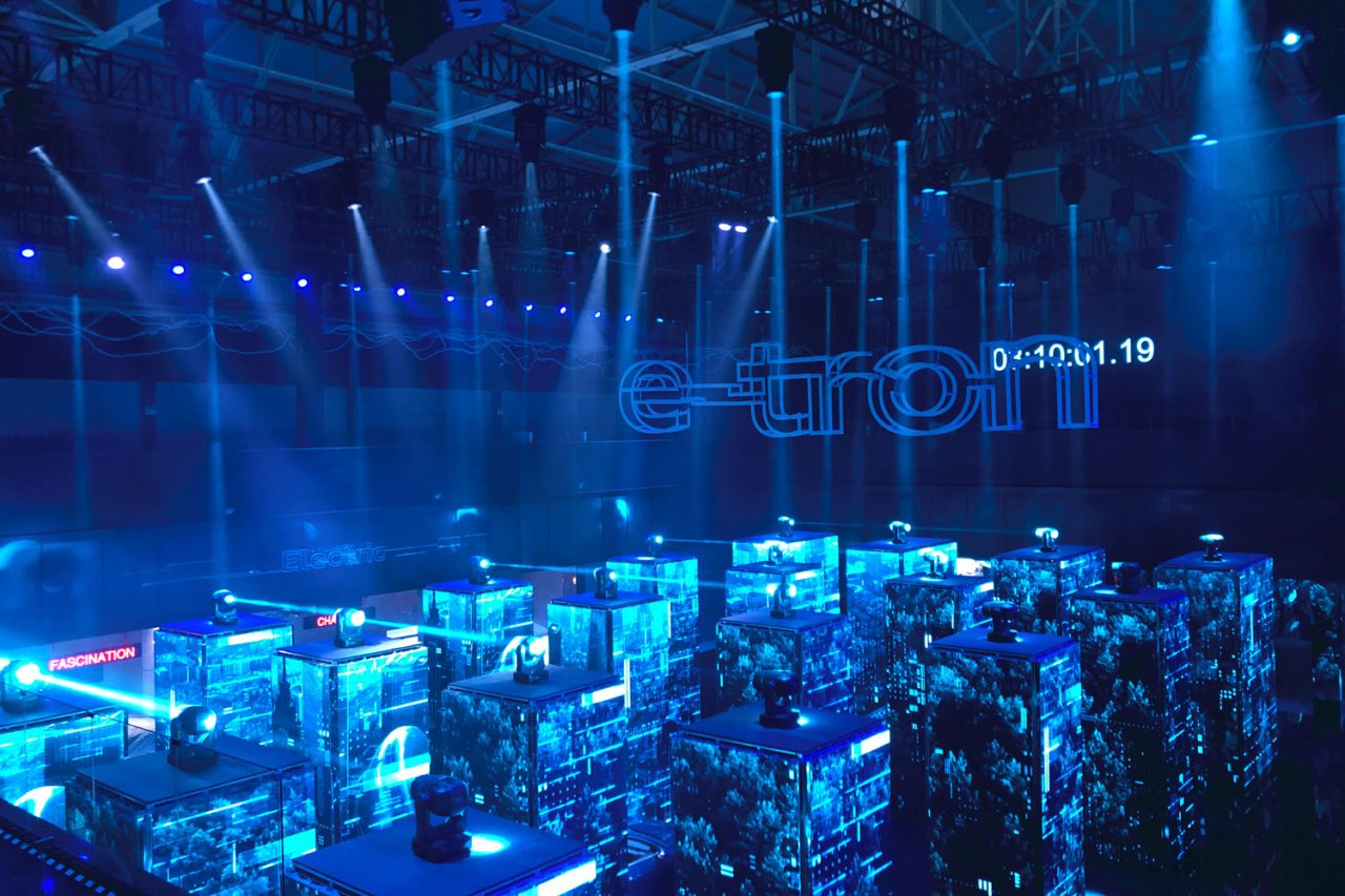 Layered LED displays glowing blue at the Audi e-tron launch.