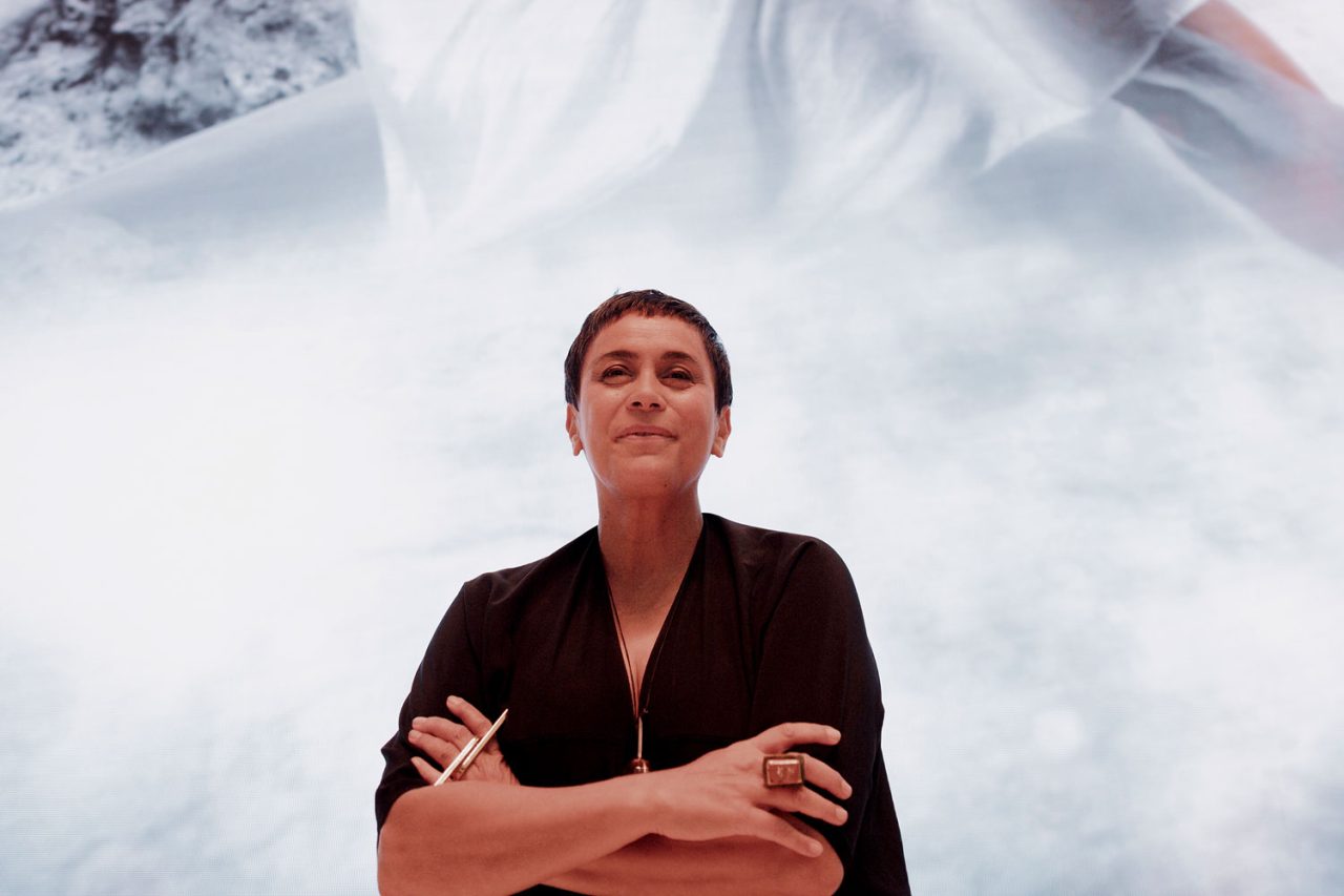 Event portrait in front of the bright digital artwork at the Aotea Centre.