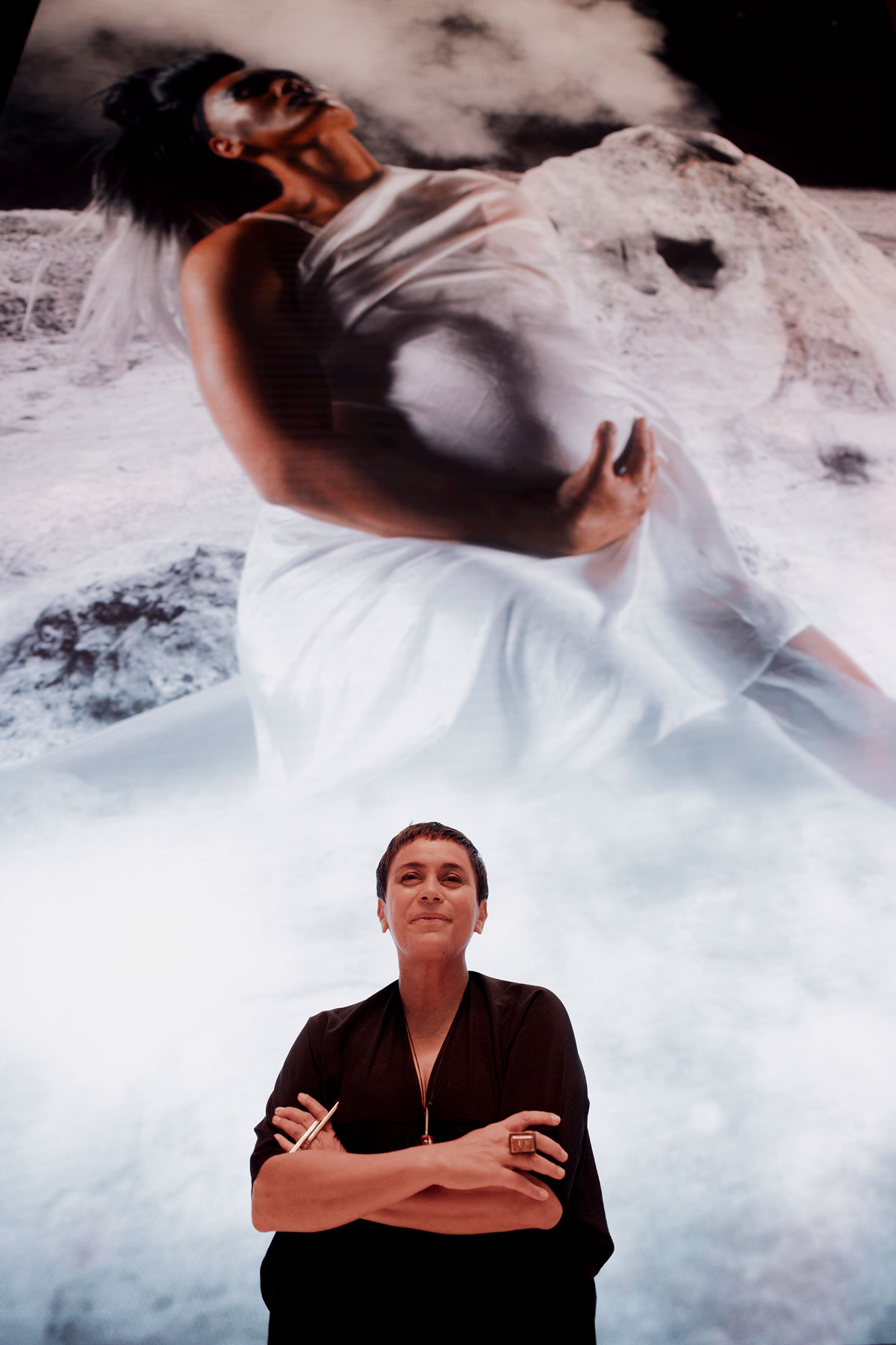 Person standing in front of Lisa Reihana's large digital artwork at the Aotea Centre.