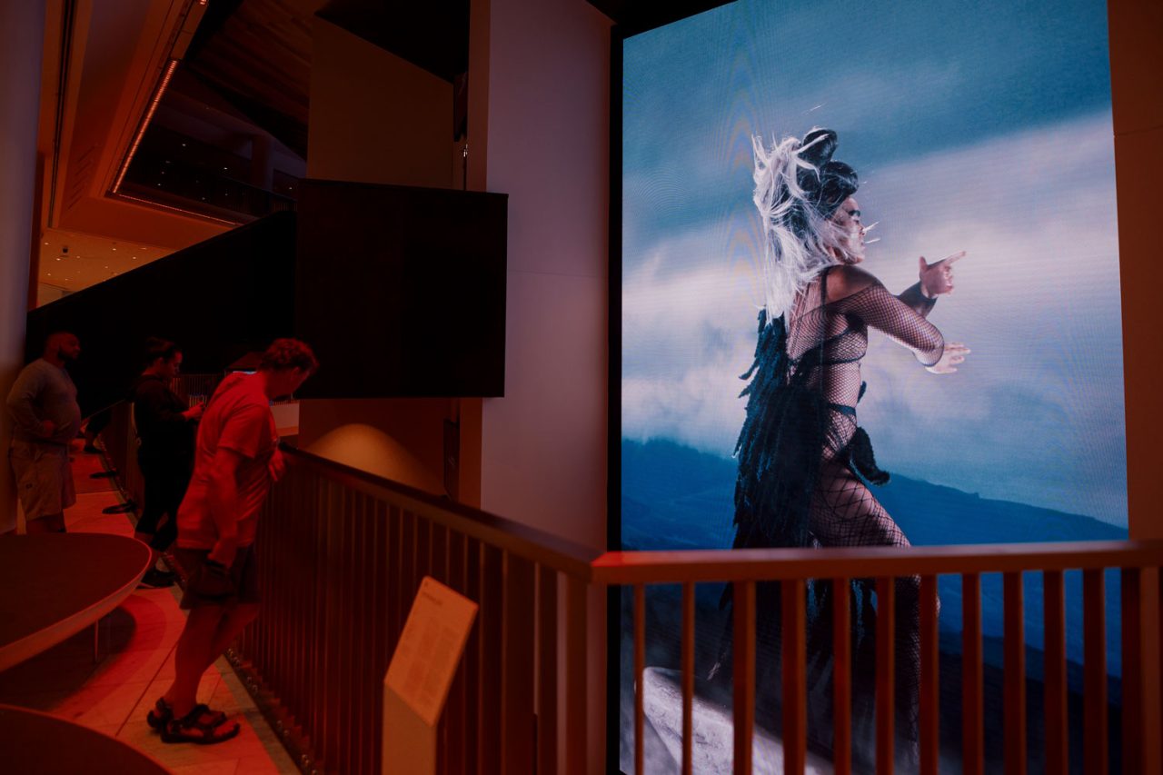A visitor views Lisa Reihana's large digital artwork at the Aotea Centre.
