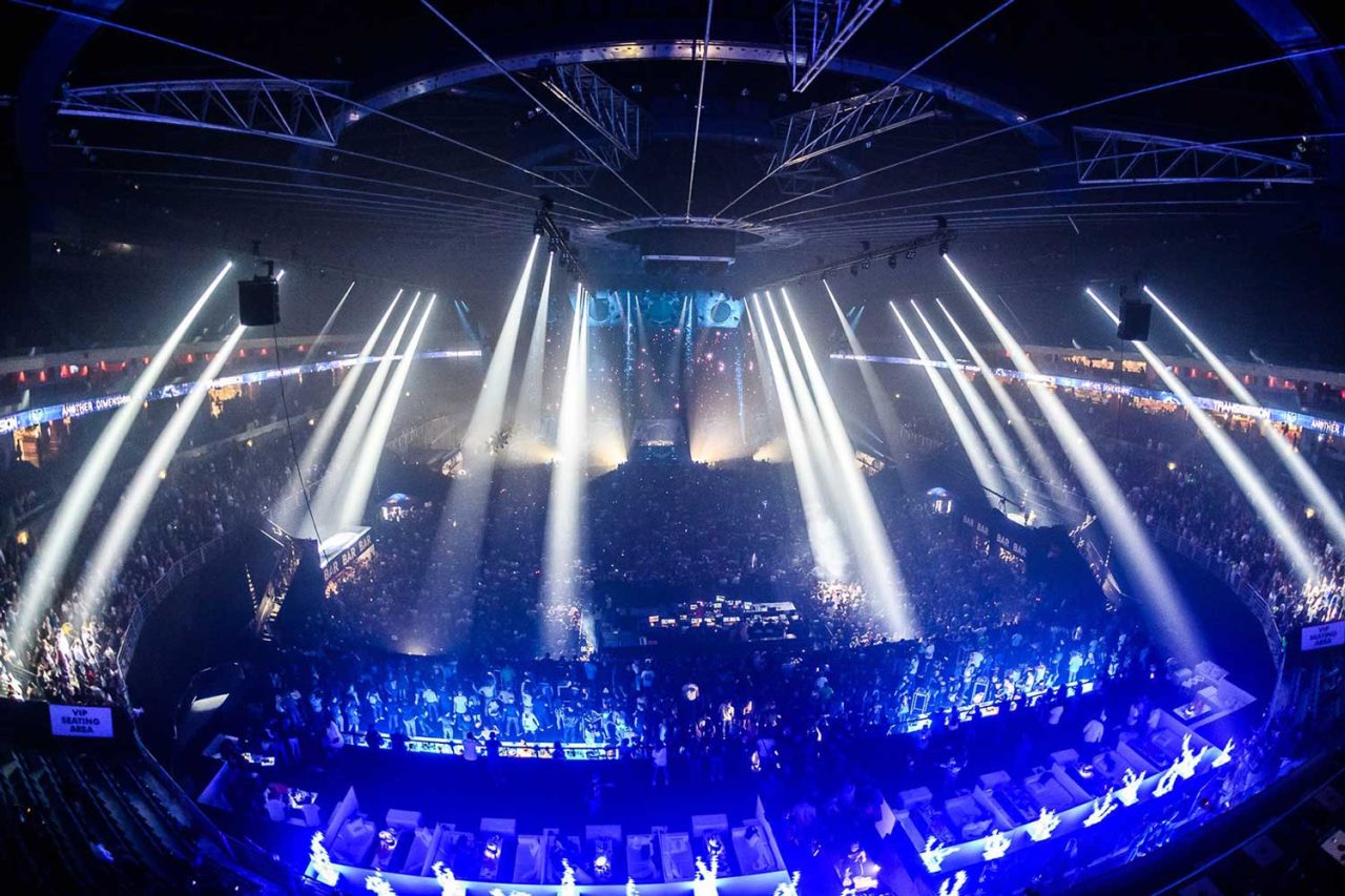 White beams radiating over a packed Transmission Festival arena.