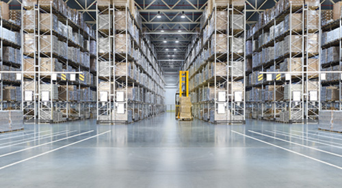 Tall storage racks lining a warehouse aisle.