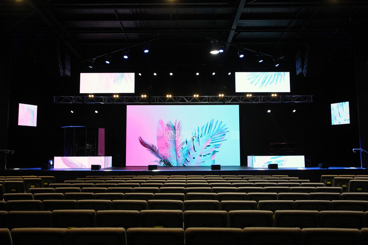 View across the seating at Glow Church Gold Coast towards the stage and its large central display.