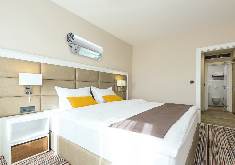 Luxibel B Hybrid unit mounted above a bed.