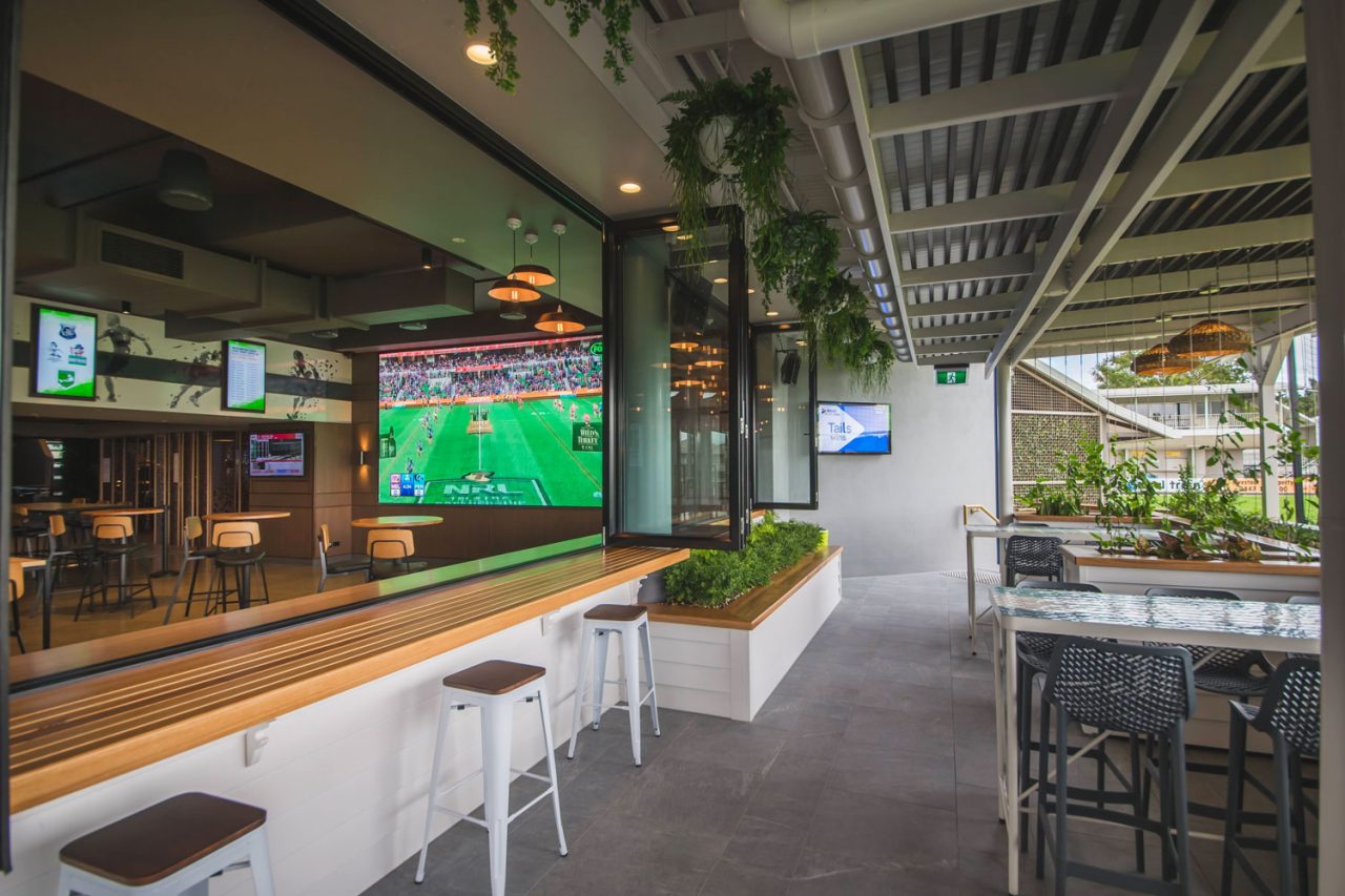 Rockhampton Leagues Club bar opening onto an alfresco area with a large sports screen.