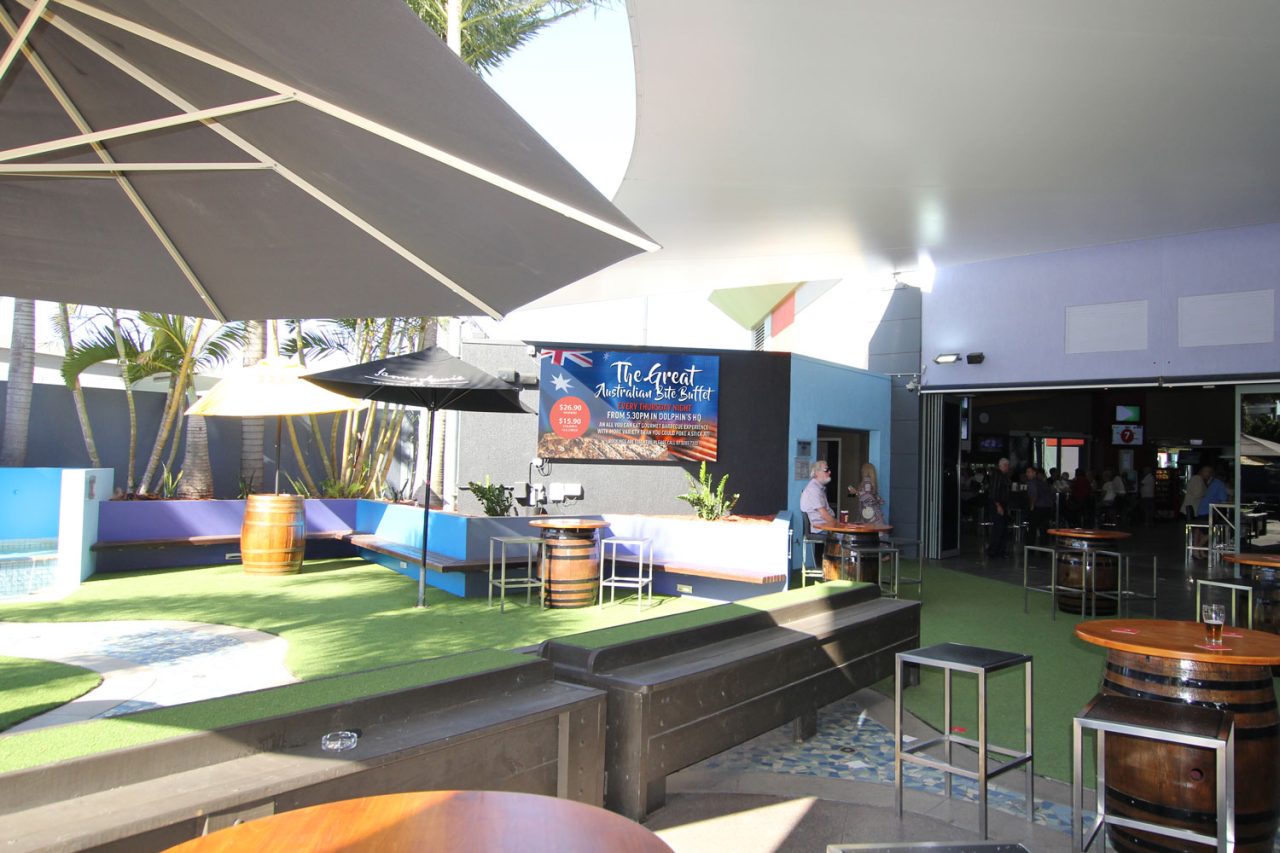 Wide view of the Redcliffe Leagues Club sports-bar terrace and outdoor screen.