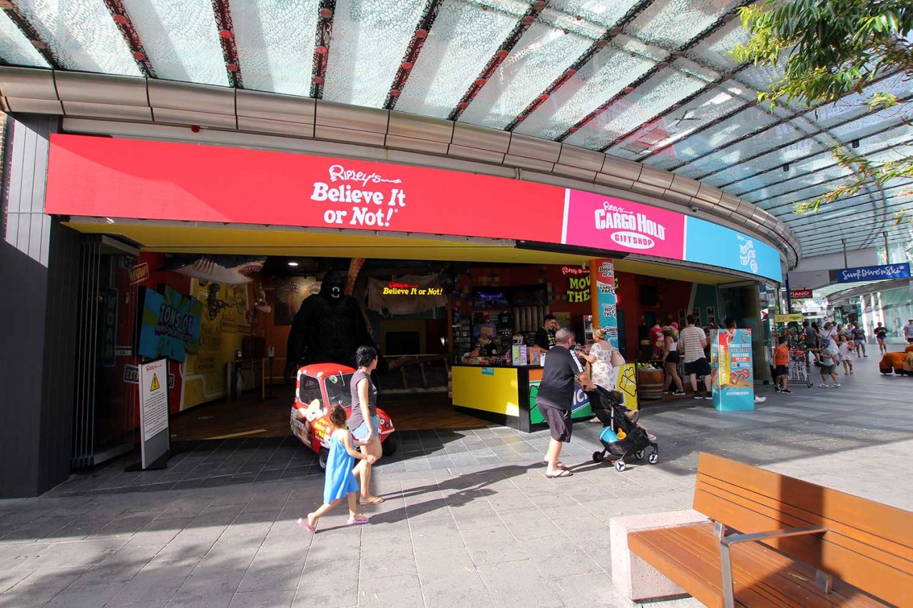 Curved digital entrance sign displaying red branding at Ripley’s Believe It or Not! in Surfers Paradise.